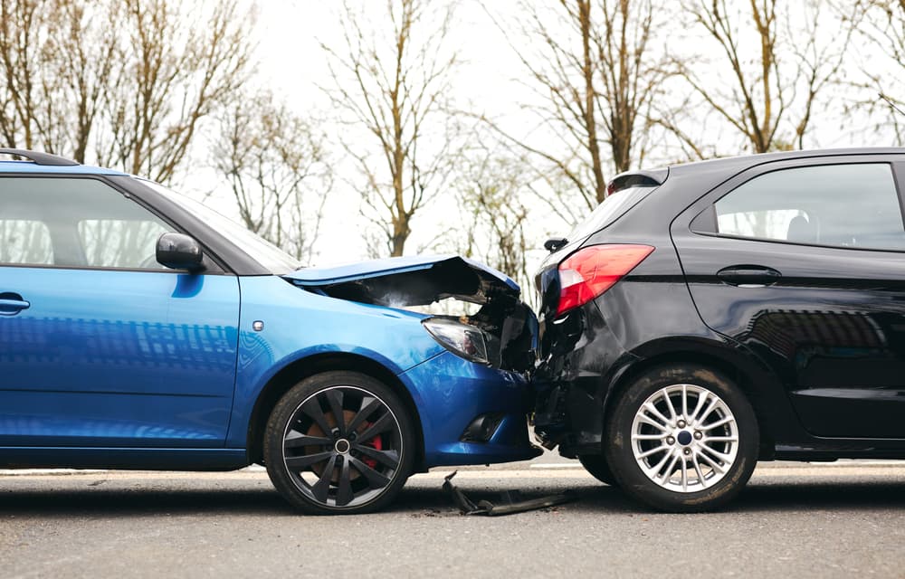 Multi-car accident on a busy road in Washington involving several modern vehicles.