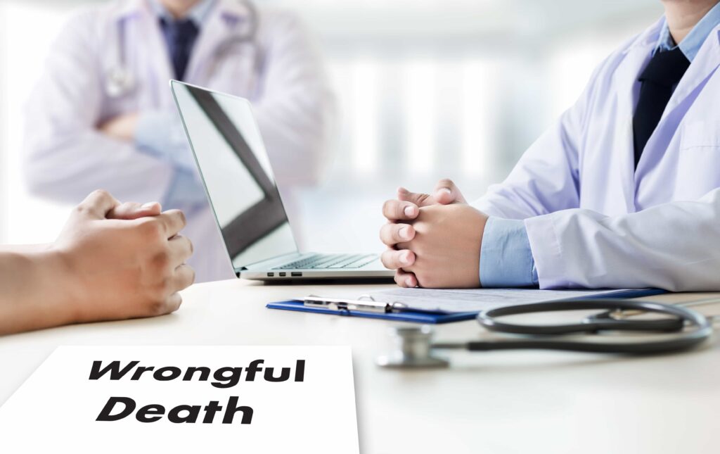doctor and client sitting with wrongful death paper