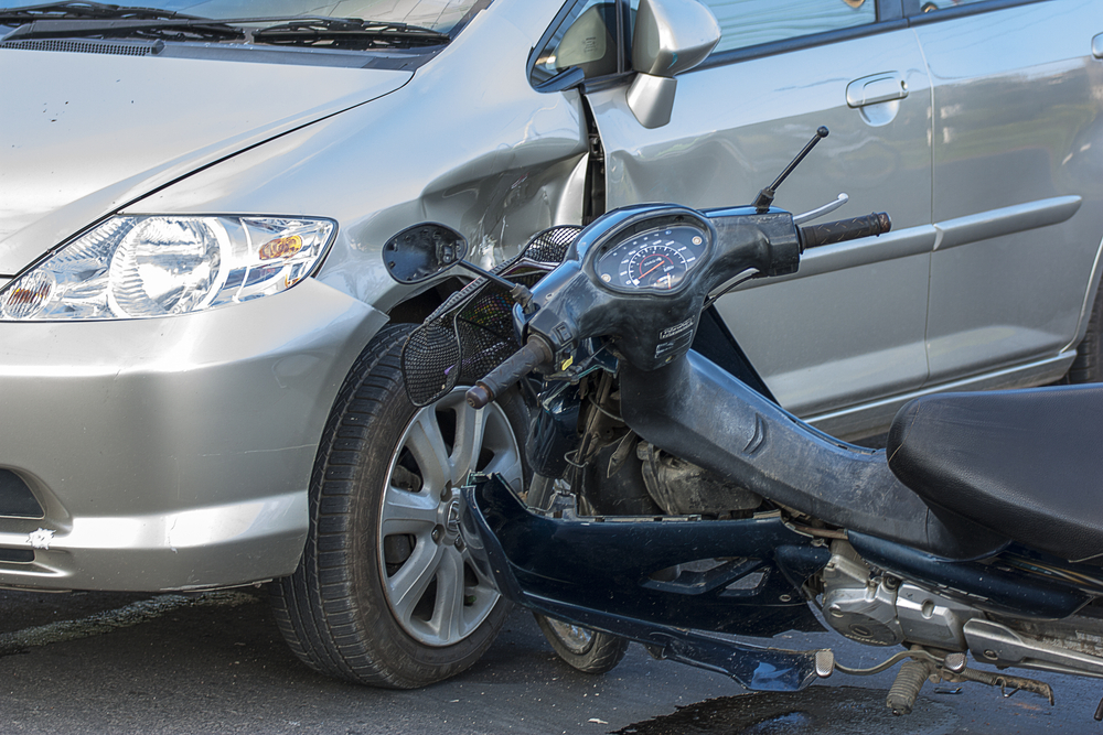 Motorcycle and car after a collision, representing a motorcycle accident case in Bellevue.
