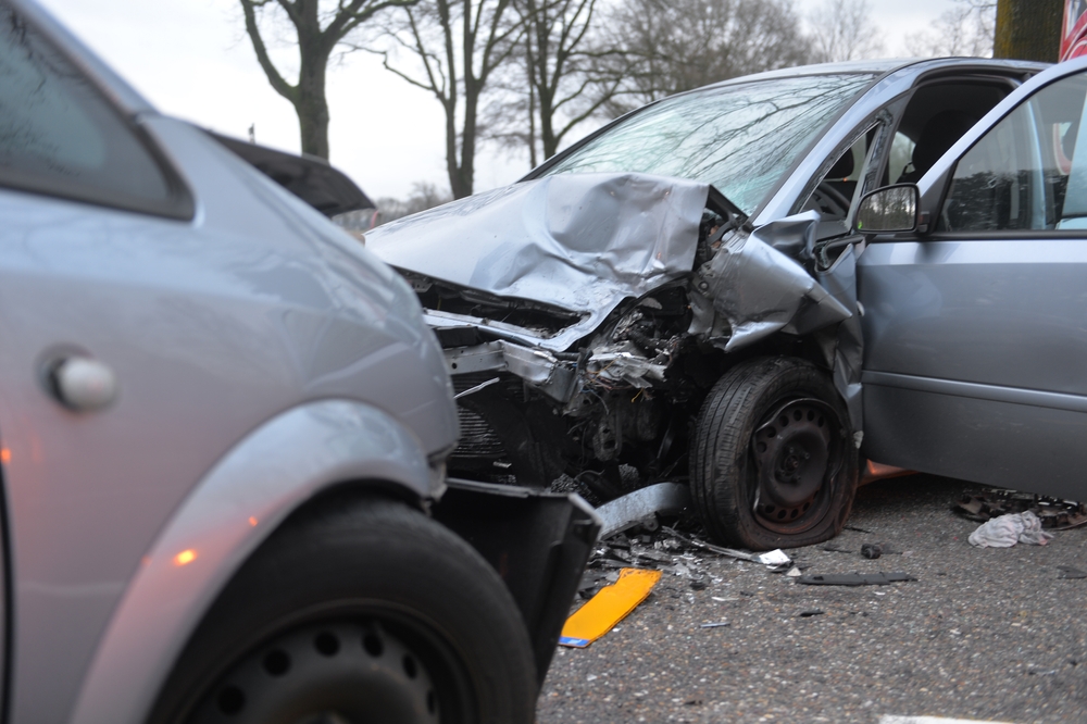 Two heavily damaged vehicles involved in a severe head-on collision in Federal Way, highlighting the force and destruction of front-impact crashes.