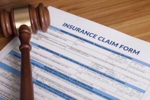 Insurance Claim Form and Judge's Gavel