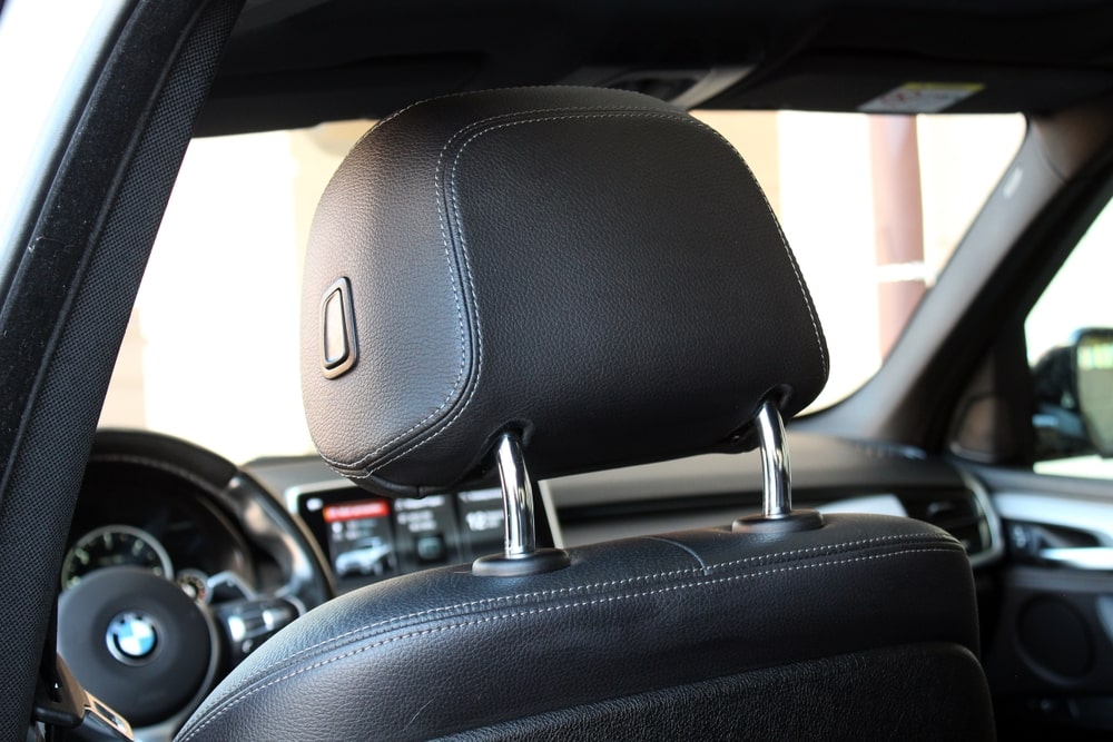 Car headrest positioned at the correct height inside a vehicle
