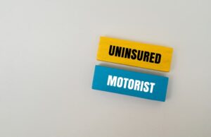 Uninsured motorist coverage concept shown with “Uninsured Motorist” text blocks